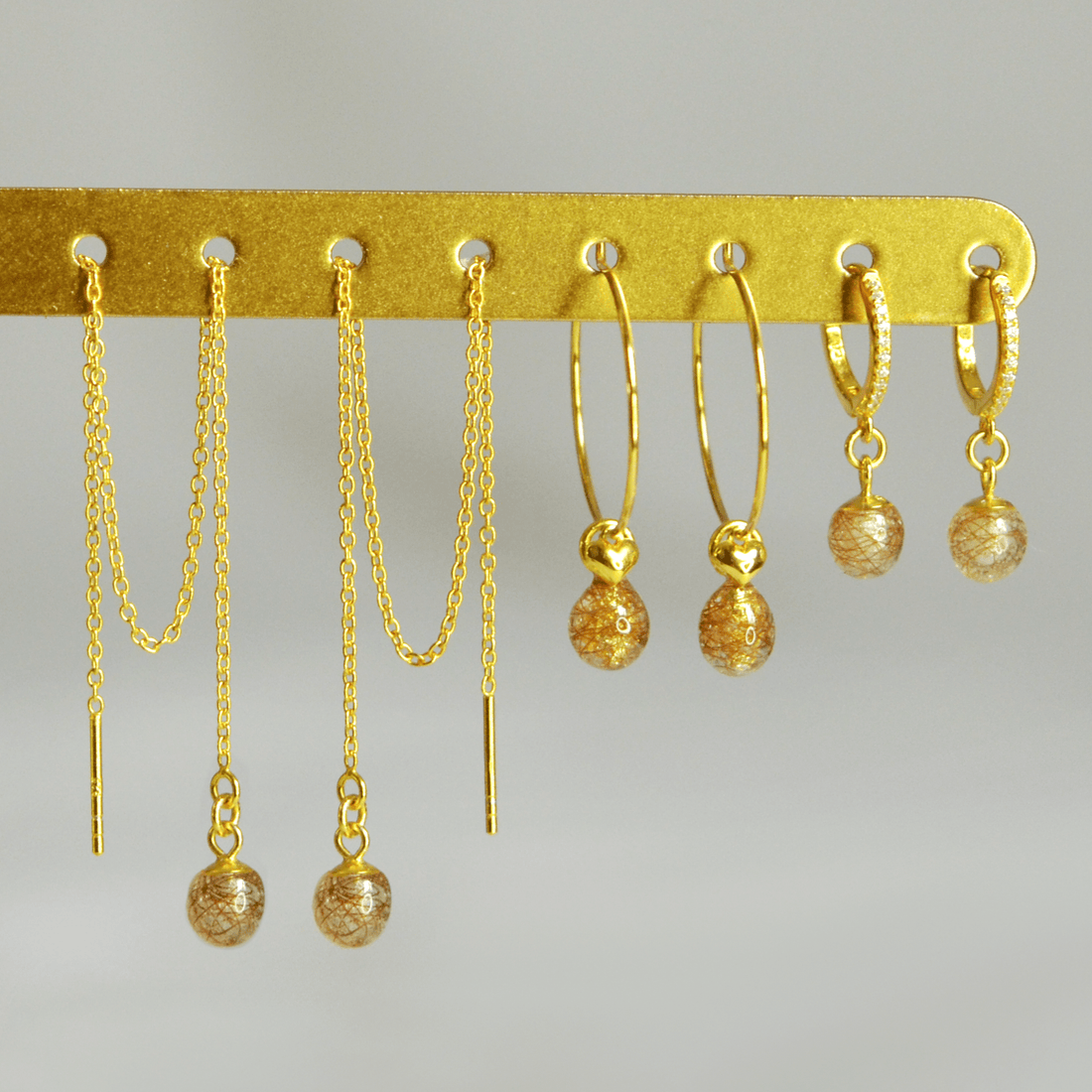 Lyvine, Laufey and Lusia earrings in gold-plated 925 sterling silver side by side